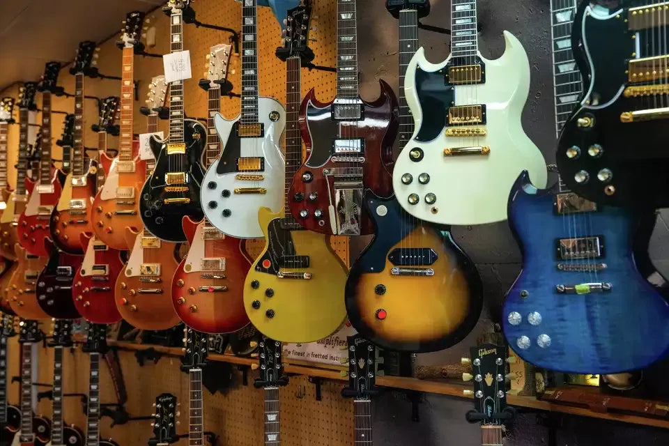 Rows of left-handed electric guitars displayed in the Southpaw Guitars showroom