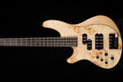 Burnt orange electric bass guitar on a black background